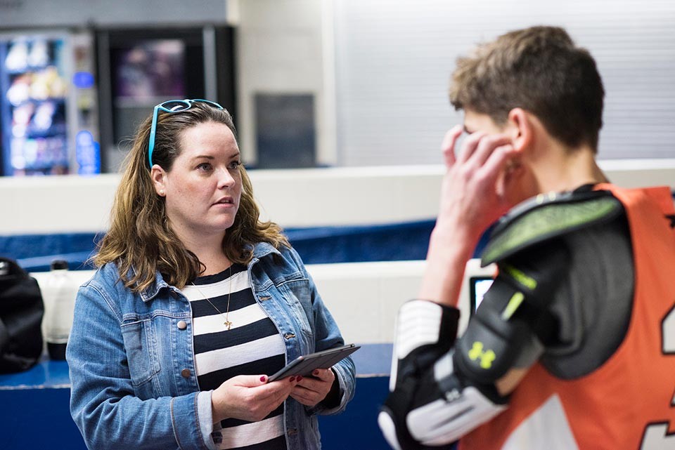 Image of Kerry talking to a hockey player