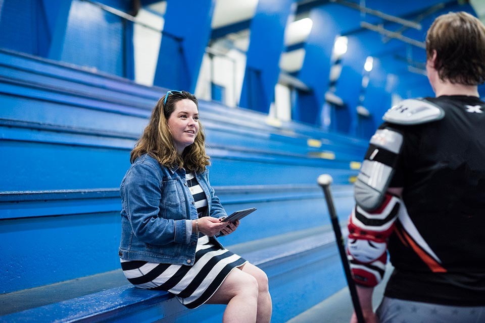 Image of Kerry talking to a hockey player