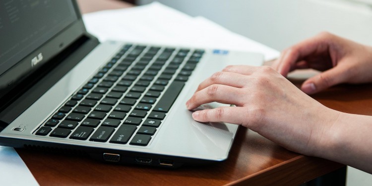 Hands on a laptop