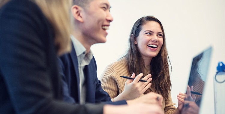 Students smiling and having fun in a small class
