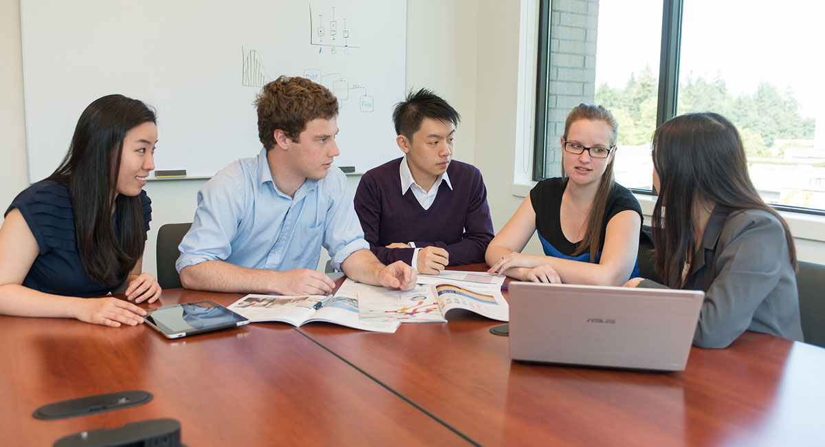 Group of professionals sitting around a table
